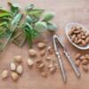 almonds on a table with a nut cracker
